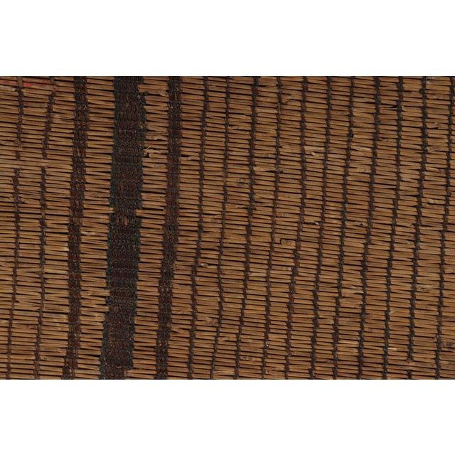 Made with handwoven reed and camel leather in Mauritania, this 2x12 vintage Tuareg mat- runner is an exceptional new...