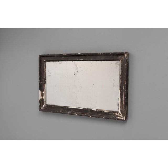 Late 19th century pine framed mirror in original distressed paint finish. Original glass with foxing to the glass. France...