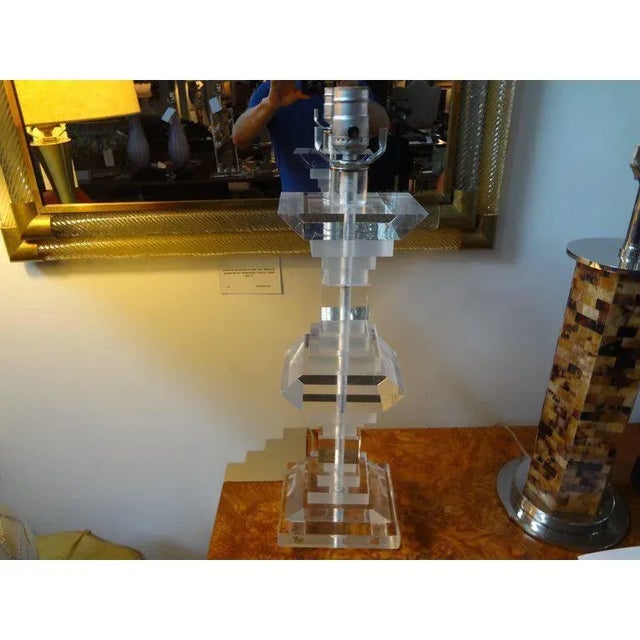 Stunning pair of art deco style lucite or acrylic lamps. Made in the 1970s. These Karl Springer style geometric form...