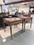 A handsome pair of Kreiss Louis XVI style writing tables that blend classical French design with refined functionality....