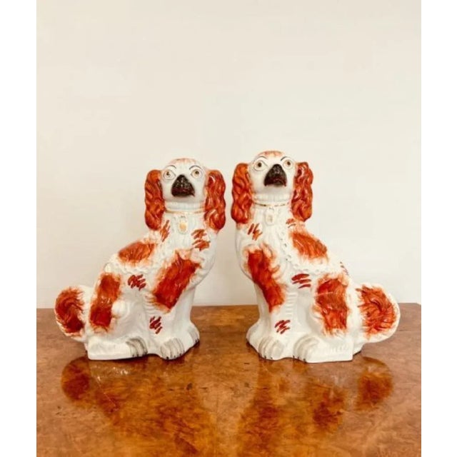 Quality pair of large antique Victorian seated spaniels, having matching coats and padlocks, hand painted in wonderful red...