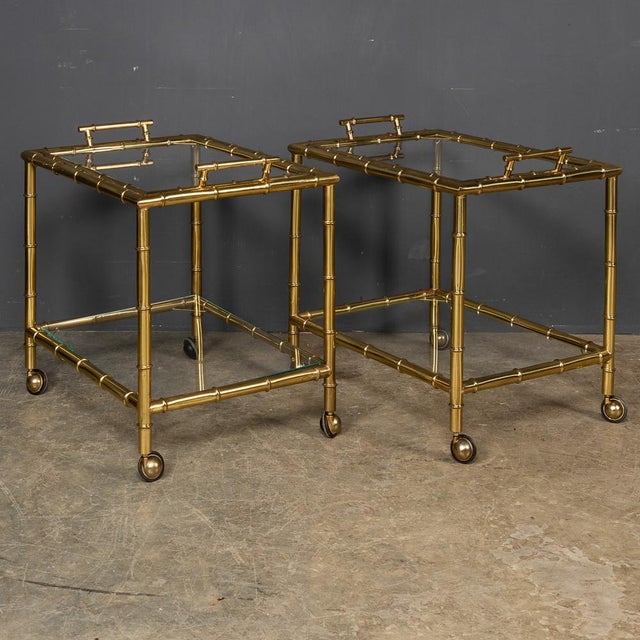 Stylish mid 20th Century French brass faux bamboo two-tier trolleys, this fine pair of trolleys have their original...