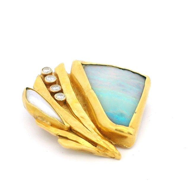 A beautifully handcrafted American studio brooch created in solid 22 karat yellow gold, dating to the late 1970s–1980s....