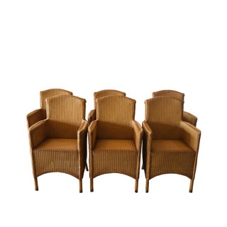 Late 20th Century Set of 4 Tan Lloyd Loom Chairs With Arms For Sale