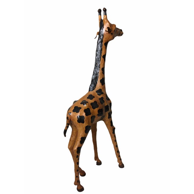 This handsome, vintage, leather-bound giraffe has a personality all of it’s own. Crafted from paper maché and wrapped in a...