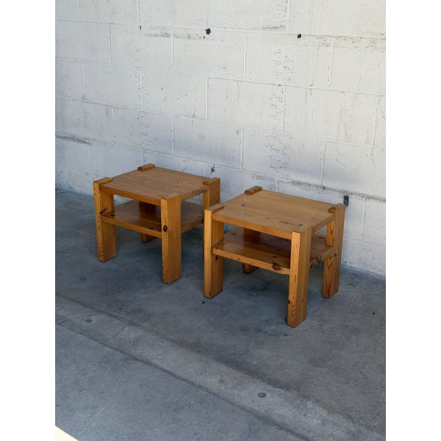Beautiful pair of vintage Danish side tables crafted in solid pine with a bold Scandinavian Modern design. These compact...
