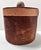 A handsome circa-1980s ice bucket wrapped in genuine cowhide and accented with hand-tooled leather detailing. The design...
