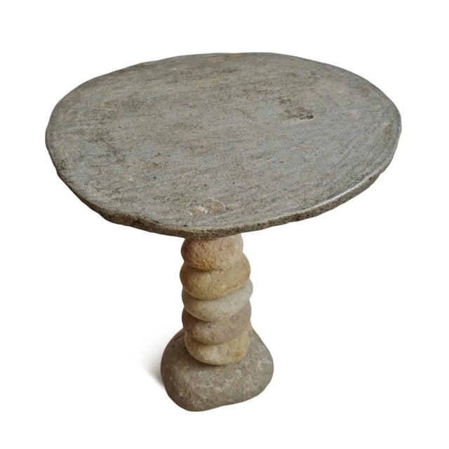 Hand crafted vintage stacked river rock outdoor bistro table. Beautiful organic modern style piece with natural tones and...