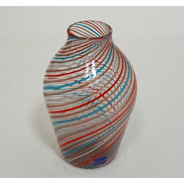 A Fratelli Toso a canne glass vase manufactured, circa 1965. Made by fusing clear, blue, pink, red and aventurin glass...