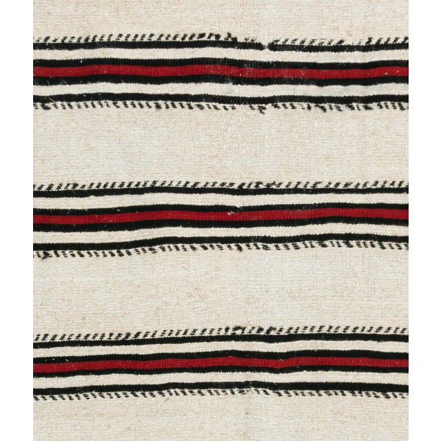 This vintage Turkish flat weave Kilim was hand-woven in the 1940's. The simplicity and boldness of this piece can also...