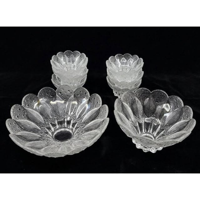 An exceptional, vintage 8-piece dessert and serving set in the striking "Medea" pattern, manufactured by the historic...