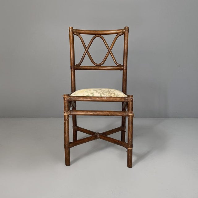 Italian chair in rattan and floral fabric, early 20th century Chair with a square seat in floral fabric and rattan frame...