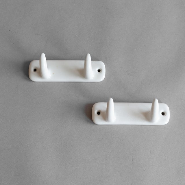 Pair of Swedish mid-century porcelain hooks. Circa 1960.