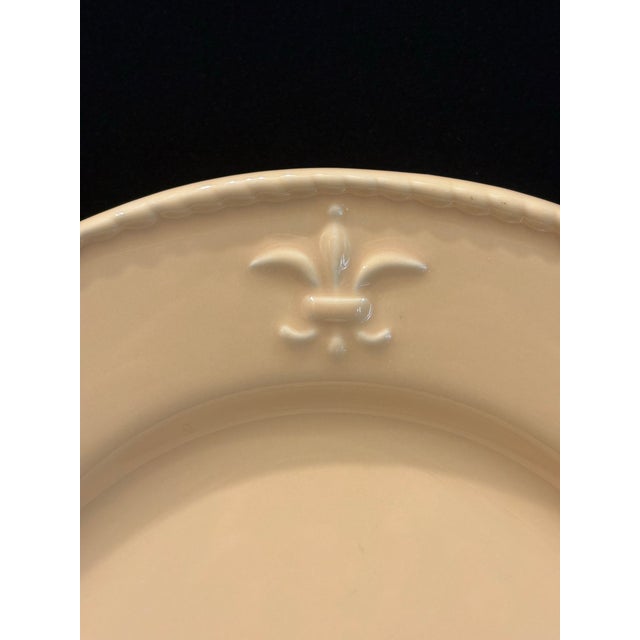 This sturdy set of plates from Bordallo Pinheiro feature an embossed fleur-de-lis with a braided border in a trendy...