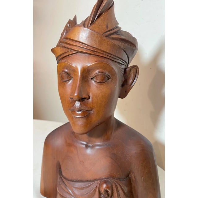 Up for sale is a wonderful antique hand carved wooden Balinese bust sculpture. It's carved by hand out of a very dense,...
