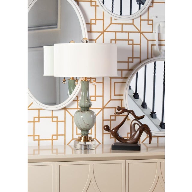 Belle mont lamp is an exquisite 28" table lamp featuring marbled art glass. The graceful gourd shaped glass is mounted on...