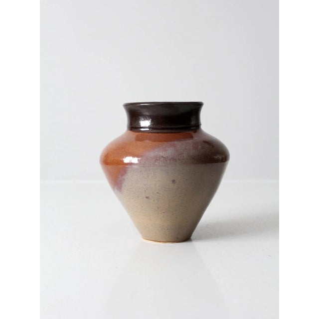 Vintage studio pottery vase with a beautifully hand-crafted form and a richly layered three-tone glaze in near black,...