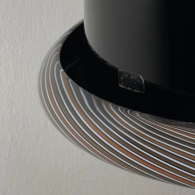 Amazing rare black murano pendant lamp. Made in italy in the 1960s. the lamp is in very good vintage condition, with no...