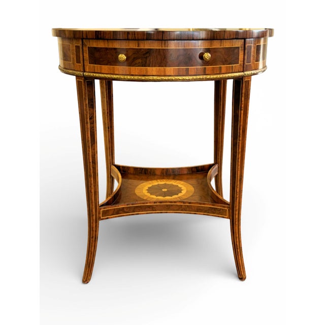Maitland Smith Sheraton Style Round Inlaid Side Table. Features high-quality construction with lovely mahogany, satinwood,...