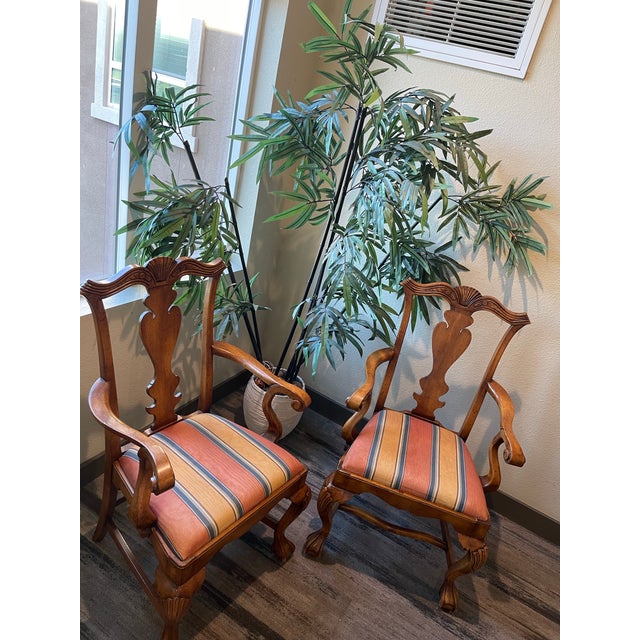 This exceptional pair of chairs carries an authentic, numbered design inventory registry sticker from Swimmer Cole...