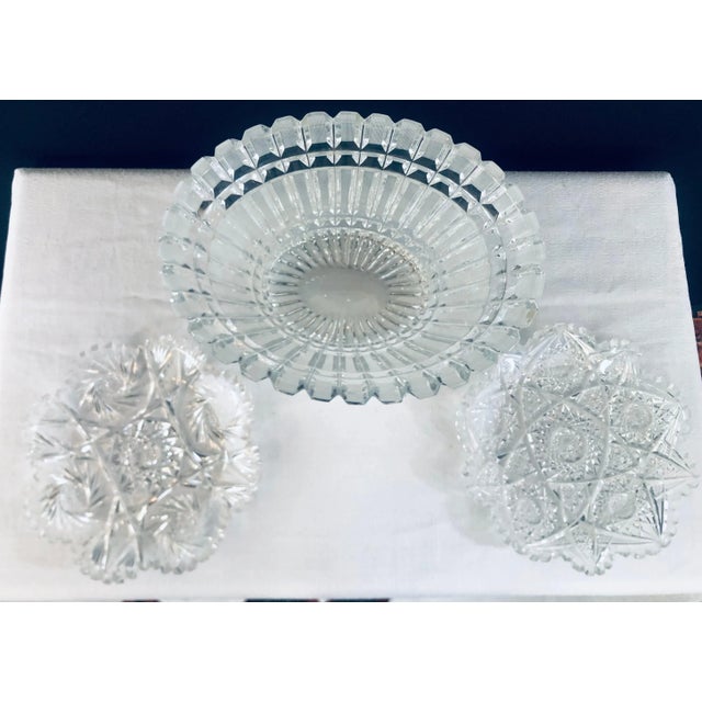 A set of hand cut large crystal bowl and two small plates with fine design bowl 5"H x 11"W x 9"D plates 8" diameter