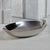 Elegant yet understated, this polished metal oval bowl brings a touch of modern refinement to your table or countertop....