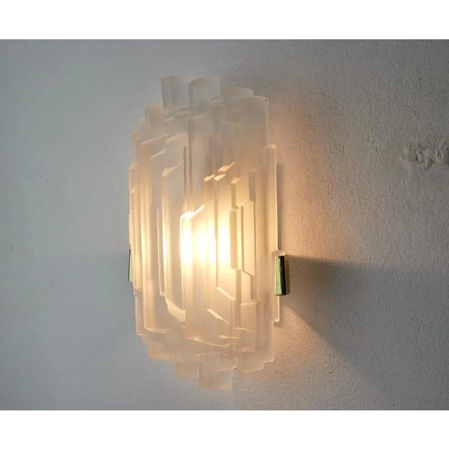 Superb frosted wall lamp, designed and produced by j.t kalmar in austria in the 1970s. This wall lamp will bring a real...