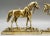 A lovely quality pair of 19th-Century English cast solid bright gilt brass mantel horses circa 1890. These handsome...