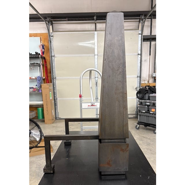 A monumental pair of custom Chesneys oxidized steel andirons in the classic obelisk shape. The timeless style of these...