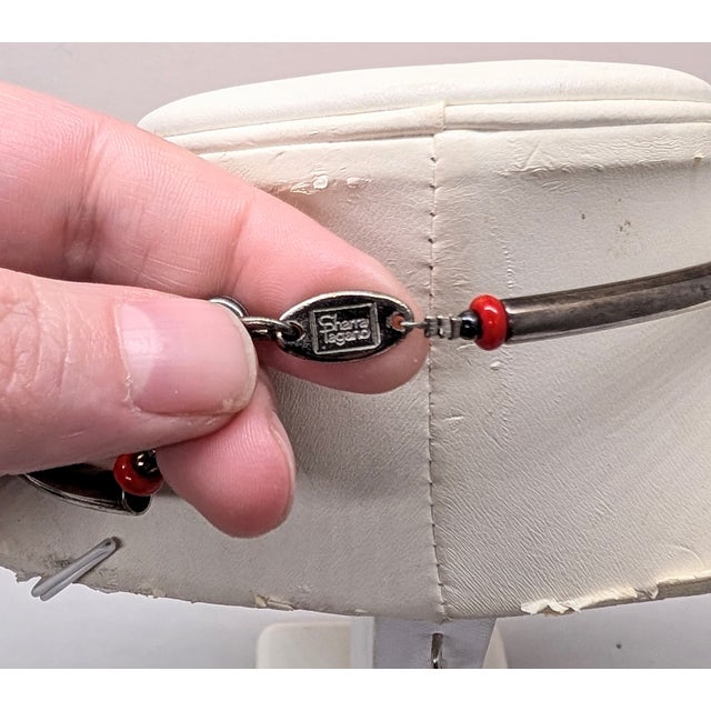 1980s silvertone red resin faux-coral with black and red glass bead spacers with silvertone tubes in the back with lobster...