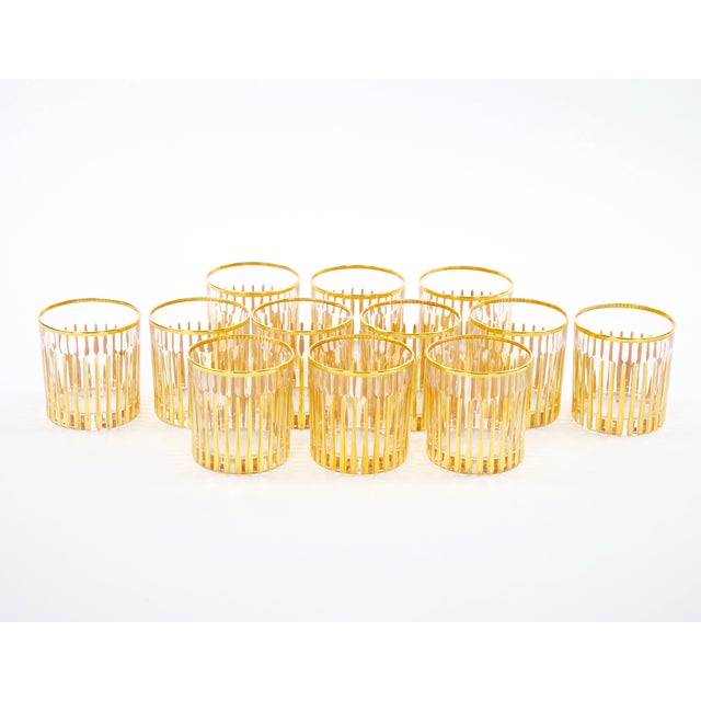 A stylish mid-century Italian barware service, made in Italy during the late 20th century and featuring an elegant 24K...