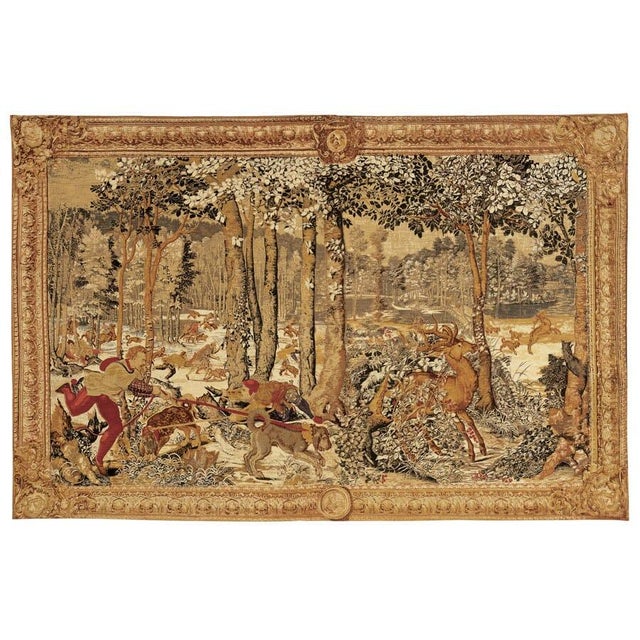 This tapestry represents the Royal Hunt in the month of August, set in the Soignes Forest in Belgium. Originally woven at...