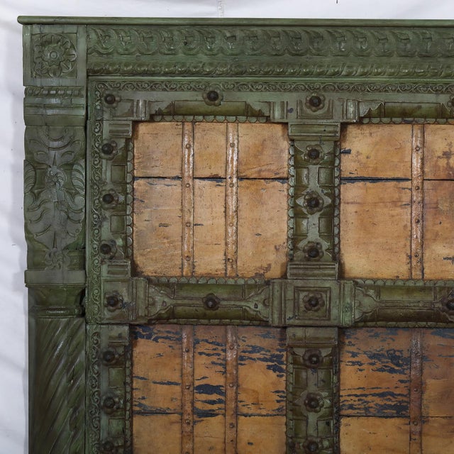 Once part of a historic Indian home, this teakwood door has been reimagined as a striking queen-size headboard. Its carved...