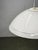 Large italian modernist pendant light from the 1970s, featuring a sculptural white murano glass shade and lacquered metal...