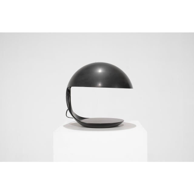 Cobra 629 table lamp in resin (bakelite color) with a swiveling arm and base. Designed by Elio Martinelli for Martinelli...