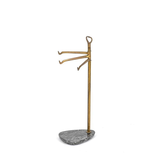 Marvelous towel stand in solid brass and Nero Marquina black marble. This incredibly elegant and unique piece was produced...