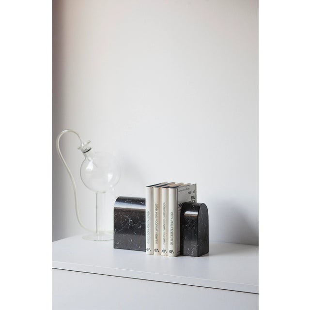 This bookend is made of Marquina marble.