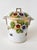 Lovely handled lidded jar with hand decorated floral pattern and painted gilt details. Crafted from bone china. Vase does...