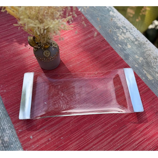 This stunning Mid-Century Modern tray by the esteemed American designer Dorothy Thorpe, was produced circa 1950. It...