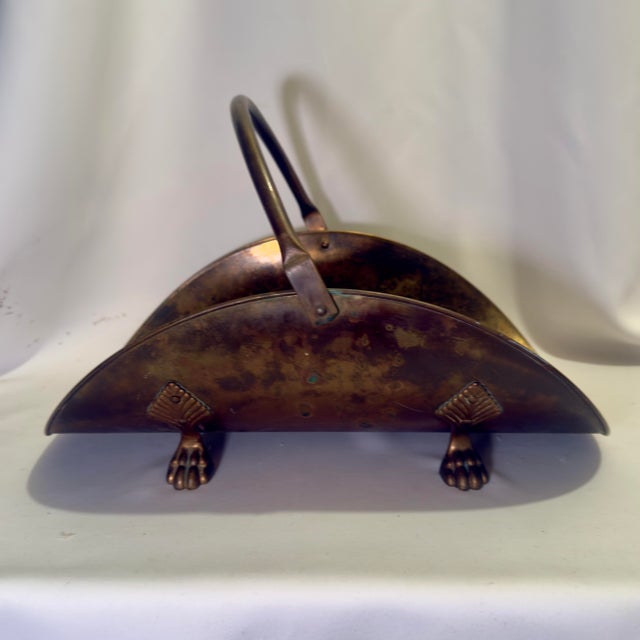 Turtle and Crane “Turning the past into stunning Decor for today.” This antique English brass coal scuttle brings the...