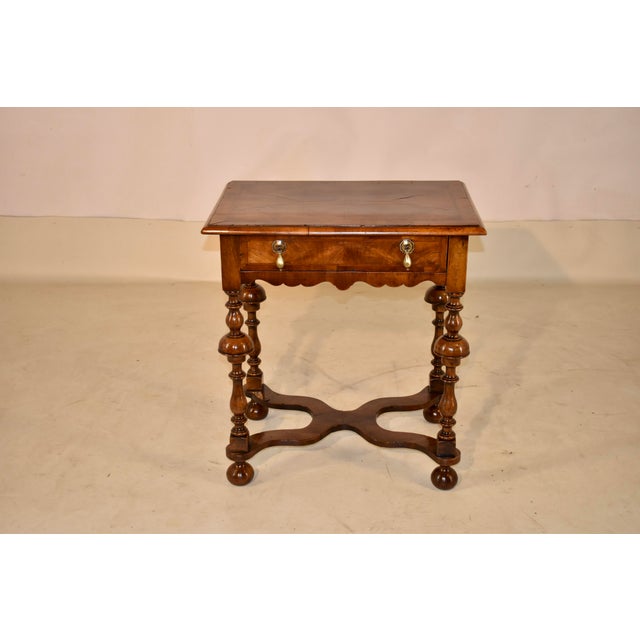 19th century burl walnut side table from England. The top has a central design of book matched burl walnut panels,...