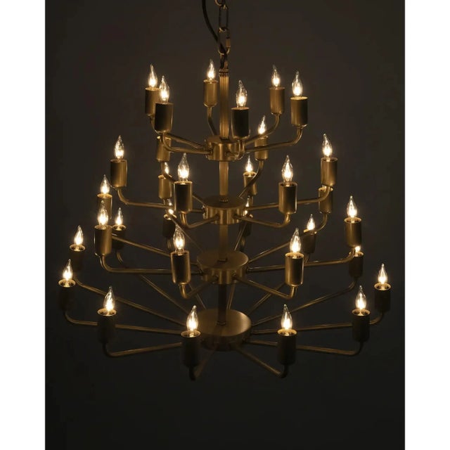 A contemporary take on a classic chandelier, the artisan crafted Montoro is expertly handcrafted, with four rows of bulbs...