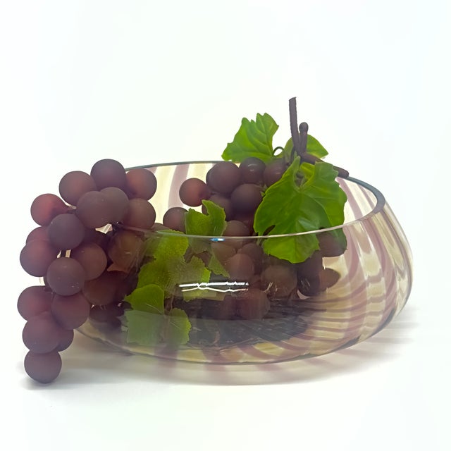 Mauve & gold glass bowl. This is a captivating decorative glass bowl, that showcases a dazzling striped pattern in mauve,...