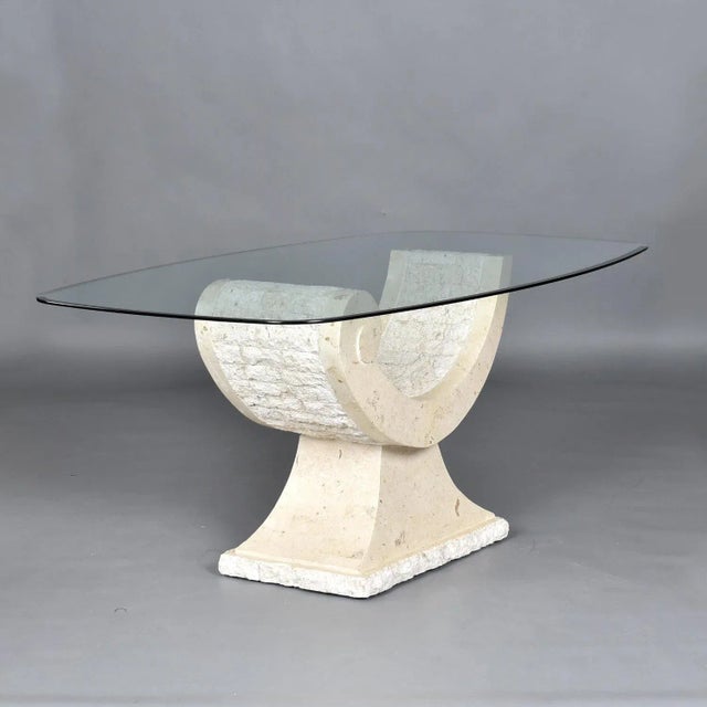 This listing is for the table alone. The chairs pictured are sold separately. Elegantly curved tessellated stone dining...