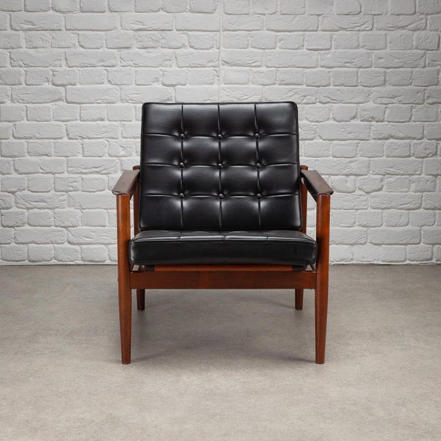 Mid century rosewood and skai armchair designed by Børge Jensen for Bernstorffsminde Møbelfabrik, Denmark, 1960s. In great...
