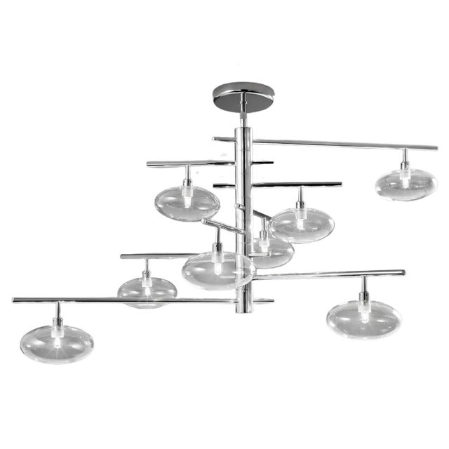 Modern Italian chandelier or flush mount with eight clear glass shades mounted on chrome finish metal frame / Made in...