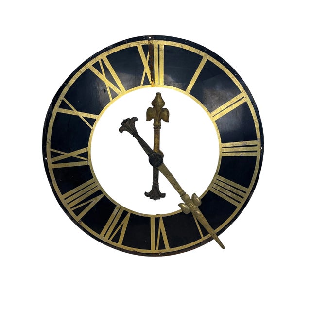 A large antique 19th-century original black metal clock face, gilt roman numerals, and gilt hands. Beautiful patina to the...