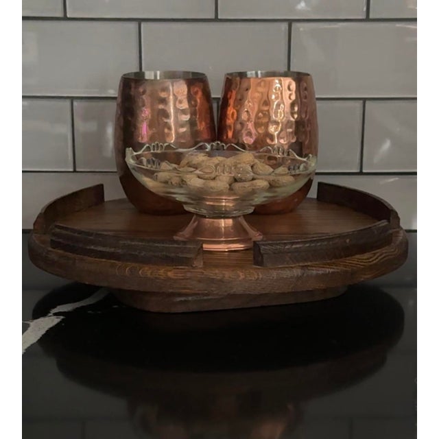 Large mid-century solid oak Lazy Susan with smooth rotation and sculptural presence. Featuring raised curved retainers and...