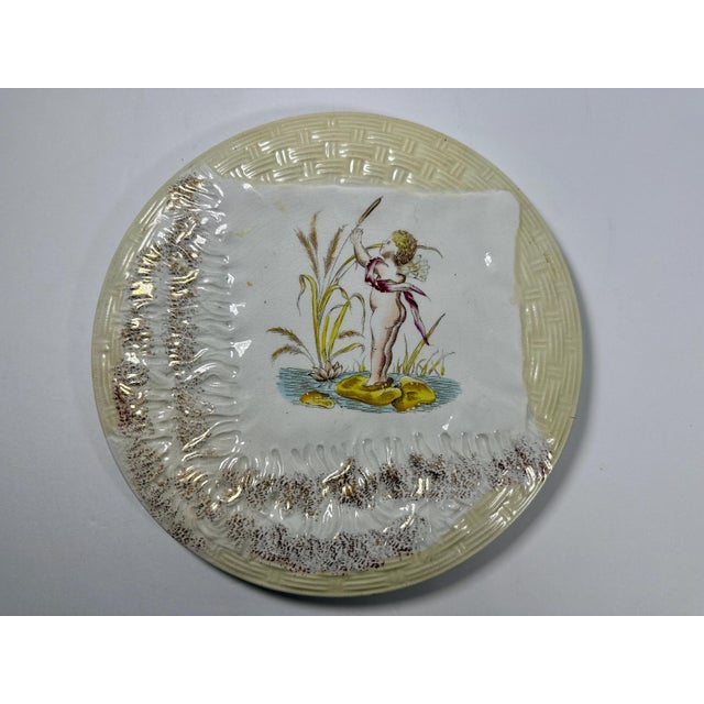 Aesthetic Movement Transferware Putto Handkerchief Plate for your consideration. The plate measures approx. 8 3/4 inches...