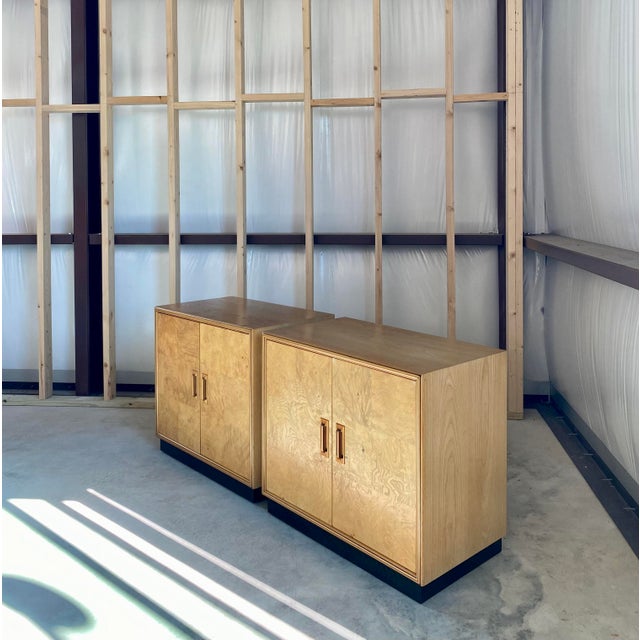 Beautiful Scene Two Henredon credenza in honey colored olive burl wood with one adjustable shelf inside each side....